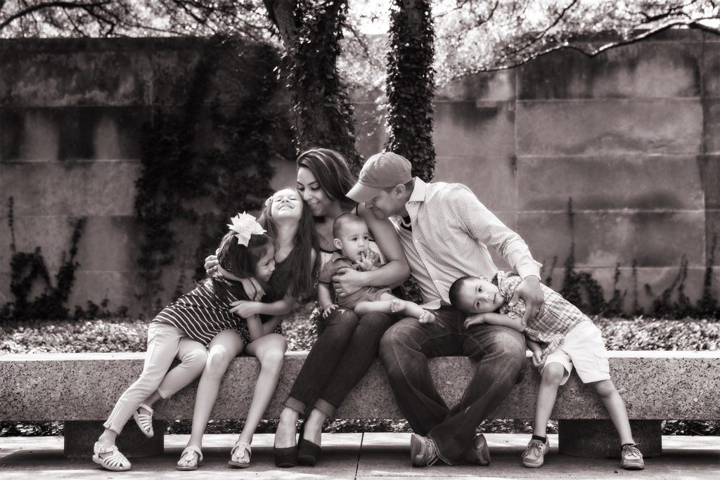 A family visiting from out of state is photographed in beautiful downtown Chicago.