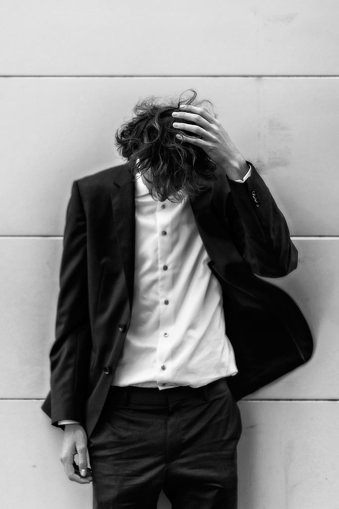 Chicago Senior Photographer 6 Black and white photo of an in between moment in the city of Chicago with a high school senior boy