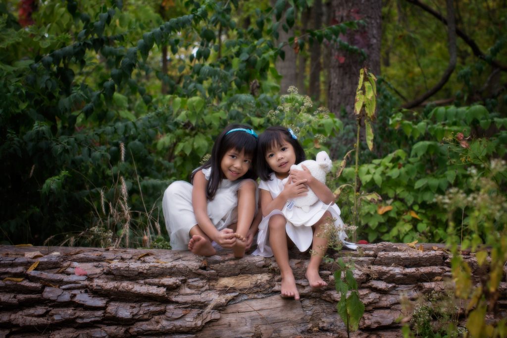 Sisters photographed in a forest in suburban Chicago by Marmalade Photography