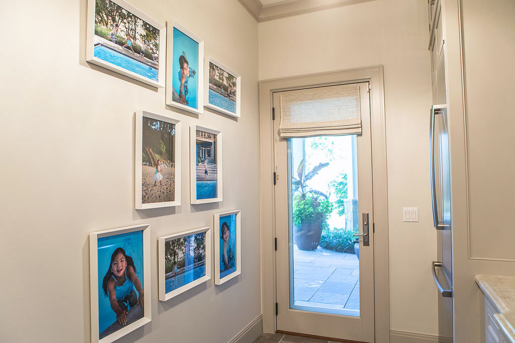 Investment 2 Wall gallery near the pool entryway in a client home by Marmalade Photography