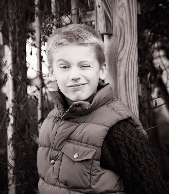 Seven year old school aged kid being silly at home in Naperville, photograph by Marmalade Photography